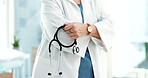 Hands, doctor and arms crossed with stethoscope in clinic, surgery and test in hospital. Closeup, cardiology expert, and medical tools for consulting, healthcare services or cardiovascular evaluation