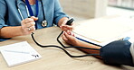 Doctor hands, patient and blood pressure at healthcare consultation for health, wellness or diagnosis. Medical worker or nurse and woman at hospital for hypertension, heart or pulse measure on arm