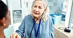 Doctor, woman and listening with stethoscope to patient heartbeat, healthcare consultation and cardiology test in clinic. Senior medical worker check chest, lungs and breathing assessment in hospital