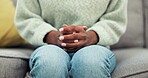 Hands, anxiety and woman on sofa in counselling for mental health crisis, help and psychology rehabilitation of trauma. Closeup, nervous and person in therapy in fear, stress and worry of depression