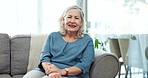 Face, senior woman and smile on sofa in home to relax for retirement, confidence and good mood. Happy portrait, elderly lady and pensioner in living room with wisdom of old age, grey hair or optimism