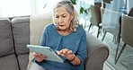 Tablet, relax and senior woman on sofa in living room scroll on social media or mobile app. Rest, research and elderly female person in retirement browsing on internet with digital technology at home