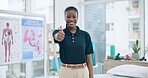 Woman, physiotherapist and thumbs up for healthcare success, thank you and anatomy support in clinic office. Portrait of doctor, African person or physical therapy worker with like, okay or yes emoji