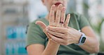 Hands, arthritis and joint pain for senior woman in house, massage and stress for emergency. Elderly lady, worry and person with disability, osteoporosis and wheelchair for retirement in nursing home