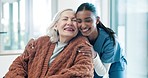 Caregiver, hug and senior woman in wheelchair with nurse for rehabilitation, medical care and service. Retirement, health worker and elderly person with disability for support, help and love at home