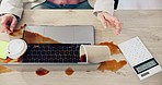 Woman, hands and coffee splash on laptop in office with calculator, budget crisis and tech problem from above. Keyboard spill, messy desk chaos and mistake, frustrated person with debt and glitch.