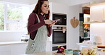 Dessert, phone picture and kitchen woman, influencer and photography of cooking, baking or flower decoration design. Creative, cellphone and home chef with floral sweets, food and post photo to app