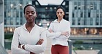 Arms crossed, fitness and face of women friends in city for training, strength or power, mindset or confidence. Exercise, portrait and lady athletes outdoor with attitude, determined or workout pride