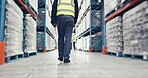 Legs, walking and engineer man in warehouse for shipping, distribution or inventory. Employee, worker and technician in factory to check supply chain stock, logistics or storage of industrial cargo