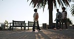 People, pavement walking and outdoor with morning commute and travel on a plaza and sidewalk. Traveling, step and students on concrete going to university, college and class on a foot path on campus