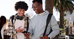 Outdoor, walking and students with a smartphone, men and connection with network, meme and conversation. Outside, people and happy  friends with a cellphone, mobile app and social media with internet