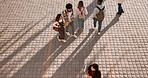 University, campus friends and walking with students, outdoor and college plaza in morning. Above group and young people with commute and travel on concrete for school, education and class at academy