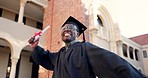 Happy black man, student and graduation in celebration for diploma, degree or certificate at campus. Excited African male person or graduate in higher education, winning or scholarship at university