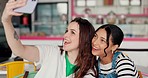 Happy student, girl friends and face selfie in a restaurant or cafe excited with bonding. Diversity, women and young people together with embrace and portrait photo for social media in coffee shop