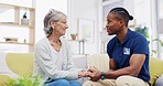 Black man, caregiver or old woman holding hands for support or empathy in cancer rehabilitation. Medical healthcare advice, senior person or male nurse nursing, talking or helping elderly patient