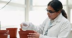 Woman, scientist and water plant in greenhouse, research and medical experiment. Science, botanist and watering vegetables for farming in pot, agriculture and study eco friendly food to test leaves.