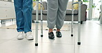 Legs, nurse and person with walking frame, physiotherapy and support in home. Walker, caregiver and patient with a disability in physical therapy, help and rehabilitation for recovery in healthcare.