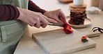 Hands, knife and cutting strawberry in kitchen, cooking and prepare healthy breakfast. Fruit, food and closeup of woman slicing on chopping board for vegan diet, organic nutrition or wellness in home