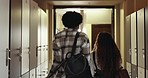 University, lockers and friends in college talking for class, lesson and learning at academy. Education, happy students and man and woman with textbooks for studying, scholarship or school in hallway