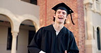 Graduation, face and man laughing with diploma, certificate and school achievement paper outdoor. Happy, smile and award with class pride at university, academy or college event with  student success