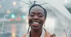 Black woman, travel and outdoor with umbrella and face, insurance and rain with smile in city. Commute, journey to work and wet winter weather, urban street and professional in portrait with security