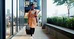 Walking, business and woman with smartphone, travel and luggage with connection, social media and network. African person, traveler and employee with suitcase, cellphone and mobile app with email