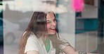 Smile, conversation and woman at a coffee shop with funny, comic or comedy joke communication. Happy, laughing and young female person from Australia in discussion by a restaurant or cafe window.