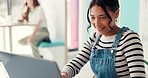 Laptop, remote work and a woman blogger in a bakery while working on content for her website. Computer, smile and a happy young customer typing a blog article as a freelance journalist in a cafe