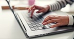 Person, hands and typing on laptop keyboard for digital research, planning information or email at coffee shop. Closeup, freelancer and editing blog for article, online course or social media in cafe