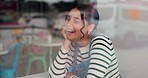 Laugh, conversation and girl friends at a cafe with funny, comic or comedy joke communication. Discussion, happy and young women gossip together with a smile by a restaurant or coffee shop window.