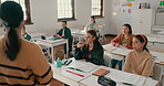 Education, school and a woman teacher in a classroom for learning, growth or development with a lesson. Scholarship, teaching and lecture with a young educator talking to students in an academy class