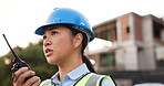 Asian woman, architect and walkie talkie in communication, construction or management for planning on site. Female person, engineer or contractor talking on radio for architecture plan or discussion