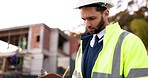 ??Man, outdoor architecture and checklist for project management at construction inspection, urban development or city. Manager writing notes on clipboard for engineering progress or buildings survey