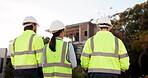 Architecture, people or engineering team walking on construction site for building or maintenance. Back view, teamwork or architect in discussion, conversation or speaking of project management plan