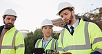 Engineering team, walking and tablet, checklist or inspection at construction site, urban planning and city architecture. Project manager and people talking of design, safety compliance and teamwork