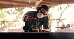 Carpenter, construction and handyman with wood project in workshop at home for renovation and maintenance. Contractor, machine an person with ppe and bokeh in workplace at house for for carpentry