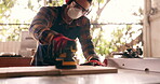 Carpenter, builder and handyman with wood project in workshop at home for renovation and maintenance. Contractor, machine an person with ppe and bokeh in workplace at house for for carpentry