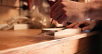 Pencil, carpenter hands and wood to measure line for construction, furniture or project. Closeup of a person marking plank with tools in a creative carpentry workshop for manufacturing, art and craft