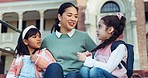 School, students and children with teacher on stairs for education, learning and lesson at academy. Campus, educator and young kids talking on steps for child development, teaching and knowledge