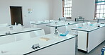 Science, classroom and learning with empty room of laboratory for education, chemistry and technology. Medicine, test and research with interior of school for college, medical and experiment