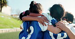 Hug, happy and children on a field for soccer success, celebration or excited about a goal. Smile, group and kids with a huddle or win with teamwork, fitness or achievement together in football