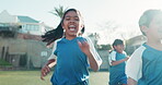 Running, children and happiness on school field for sports, development and exercise for wellness outdoor. Education, students and freedom with smile on grass for fitness, learning and healthy body