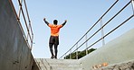 Runner man, stairs and outdoor training for celebration, achievement or goals with results in urban metro. African guy, steps and winner with success for workout, wellness and exercise for fitness