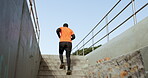 Back of man, fitness and running on steps outdoor for cardio exercise, workout and sports training. Runner, urban performance and action on stairs for energy, wellness challenge and strong endurance 