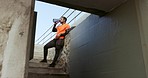 Black man, drinking water and exercise outdoor, relax after run on stairs with hydration and thirst, health and wellness. Athlete, sports and cardio with healthy runner in city, bottle with h2o 