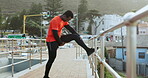 Black man, stretching legs and running in city, exercise and cardio with health and wellness outdoor, Start, fitness and runner on urban bridge, healthy and active with workout, training and race