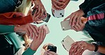 Friends group, circle and phone in low angle, campus or mobile connection with scroll, typing or click in summer. Girl students, smartphone and huddle for social network at high school in Los Angeles