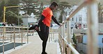 Black man, stretching legs and run in city, exercise and cardio with health and wellness outdoor, Start, fitness and runner on urban bridge, healthy and active with workout, training and race warm up