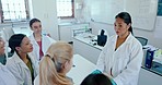 Laboratory, university and professor with students, chemistry and research with conversation, teaching and education. Teacher, classroom and academic with lesson, knowledge and studying with analysis