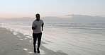 Sports, fitness or black man running on sidewalk with speed or energy outdoors for exercise in Cape Town. Sunset, wellness or healthy African runner jogging for cardio training or workout on sand